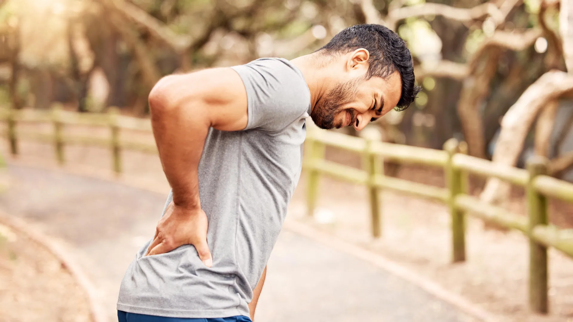 man-back-pain-outdoors