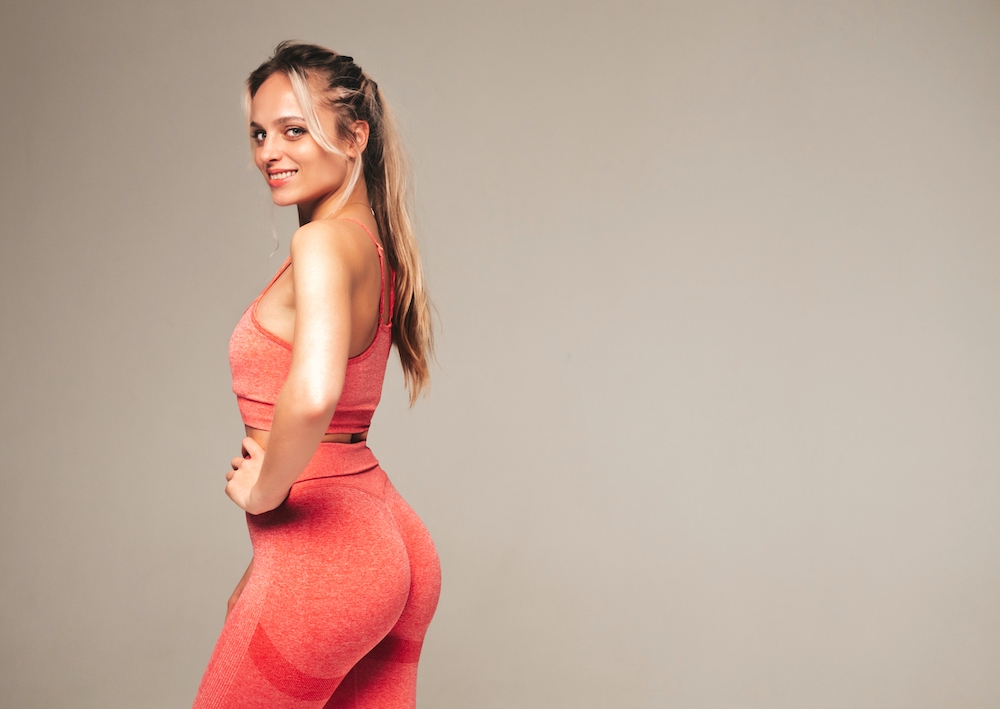 Sexy,Fitness,Smiling,Woman,In,Pink,Sports,Clothing